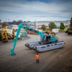 Brisvegas Machinery Delivers Custom Kobelco SK200-10 with Remu Amphibious Undercarriage.